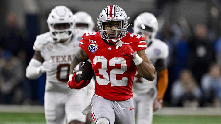 Jan 10, 2025; Arlington, TX, USA;  Ohio State Buckeyes running back TreVeyon Henderson (32) scores a touchdown on a pass from quarterback Will Howard (not pictured) during the second quarter at AT&T Stadium.