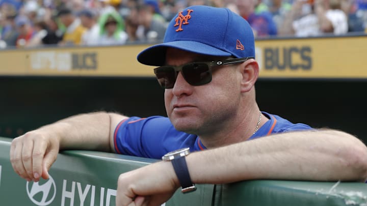 Jun 28, 2025; Pittsburgh, Pennsylvania, USA;  New York Mets manager Carlos Mendoza (64) looks over the dugout railing before the game against the Pittsburgh Pirates at PNC Park. Mandatory Credit: Charles LeClaire-Imagn Images