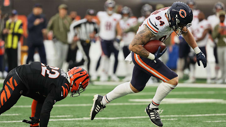 Nov 2, 2025; Cincinnati, Ohio, USA; Chicago Bears tight end Colston Loveland (84) runs with the ball for a 58-yard touchdown play against Cincinnati Bengals safety Jordan Battle (27) during the fourth quarter at Paycor Stadium. Mandatory Credit: Joseph Maiorana-Imagn Images