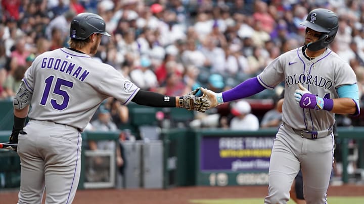 May 17, 2025; Phoenix, Arizona, USA; Colorado Rockies shortstop Ezequiel Tovar (14) slaps hands with Colorado Rockies catcher Hunter Goodman (15) after hitting a solo home run against the Arizona Diamondbacks in the third inning at Chase Field. Mandatory Credit: Jacob Reiner-Imagn Images