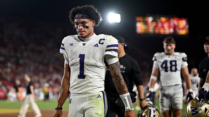 Huskies quarterback Demond Williams Jr. (1) walks off the field after a 25-21 loss to USC in Los Angeles.