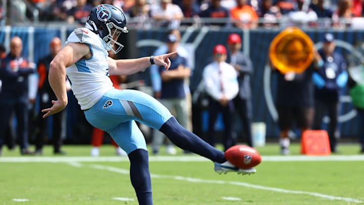 Tennessee Titans punter Ryan Stonehouse (4) punts the ball against the Chicago Bears during the first quarter at Soldier Field in 2024.