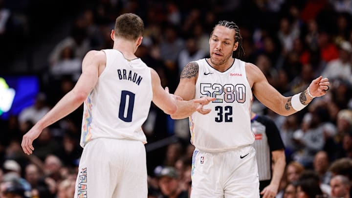 Jan 21, 2025; Denver, Colorado, USA; Denver Nuggets forward Aaron Gordon (32) reacts with guard Christian Braun (0) after a play in the third quarter against the Philadelphia 76ers at Ball Arena. Mandatory Credit: Isaiah J. Downing-Imagn Images Jan 21, 2025; Denver, Colorado, USA; Denver Nuggets forward Aaron Gordon (32) reacts with guard Christian Braun (0) after a play in the third quarter against the Philadelphia 76ers at Ball Arena. Mandatory Credit: Isaiah J. Downing-Imagn Images