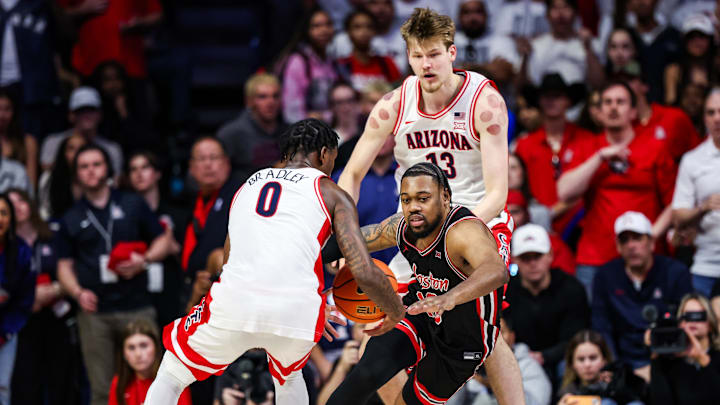 Arizona Wildcats guard Jaden Bradley (0) steals the ball from Houston Cougars forward J’Wan Roberts (13) during the second half at McKale Center. Arizona Wildcats guard Jaden Bradley (0) steals the ball from Houston Cougars forward J’Wan Roberts (13) during the second half at McKale Center.