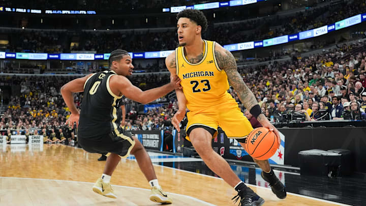 Mar 15, 2026; Chicago, IL, USA; Michigan Wolverines forward Yaxel Lendeborg (23) dribbles as Purdue Boilermakers guard C.J. Cox (0) defends during the second half during the men's Big Ten Conference Tournament Championship at United Center. Mandatory Credit: David Banks-Imagn Images Mar 15, 2026; Chicago, IL, USA; Michigan Wolverines forward Yaxel Lendeborg (23) dribbles as Purdue Boilermakers guard C.J. Cox (0) defends during the second half during the men's Big Ten Conference Tournament Championship at United Center. Mandatory Credit: David Banks-Imagn Images