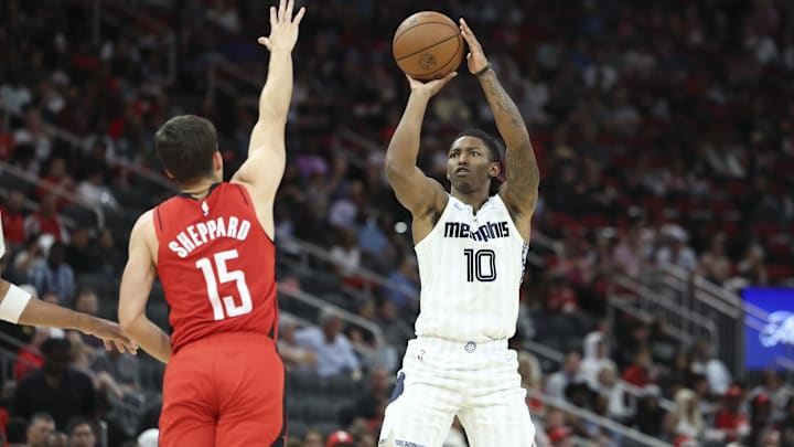 Apr 12, 2026; Houston, Texas, USA; Memphis Grizzlies guard Javon Small (10) shoots the ball as Houston Rockets guard Reed Sheppard (15) defends during the third quarter at Toyota Center. Mandatory Credit: Troy Taormina-Imagn Images