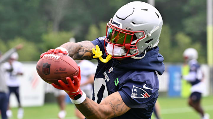 Jun 9, 2025; Foxborough, MA, USA; New England Patriots cornerback Christian Gonzalez (0) catches the ball during minicamp at Gillette Stadium. Mandatory Credit: Eric Canha-Imagn Images