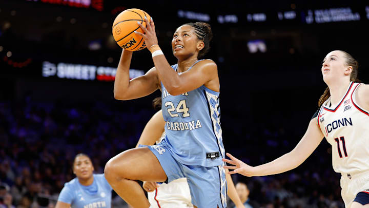 Mar 27, 2026; Fort Worth, TX, USA; North Carolina Tar Heels guard Indya Nivar (24) drives to the basket ahead of UConn Huskies guard Allie Ziebell (11) during the second half at Dickies Arena. Mandatory Credit: Chris Jones-Imagn Images Mar 27, 2026; Fort Worth, TX, USA; North Carolina Tar Heels guard Indya Nivar (24) drives to the basket ahead of UConn Huskies guard Allie Ziebell (11) during the second half at Dickies Arena. Mandatory Credit: Chris Jones-Imagn Images