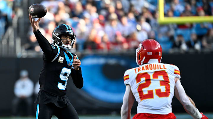 Nov 24, 2024; Charlotte, North Carolina, USA;  Carolina Panthers quarterback Bryce Young (9) passes the ball as Kansas City Chiefs linebacker Drue Tranquill (23) defends in the third quarter at Bank of America Stadium. Mandatory Credit: Bob Donnan-Imagn Images