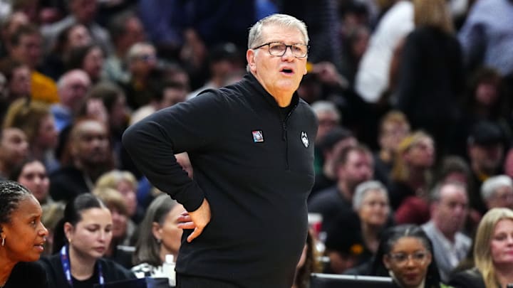 Apr 5, 2024; Cleveland, OH, USA; Connecticut Huskies head coach Geno Auriemma looks on in the first quarter against the Iowa Hawkeyes in the semifinals of the Final Four of the womens 2024 NCAA Tournament at Rocket Mortgage FieldHouse. Mandatory Credit: Kirby Lee-Imagn Images
