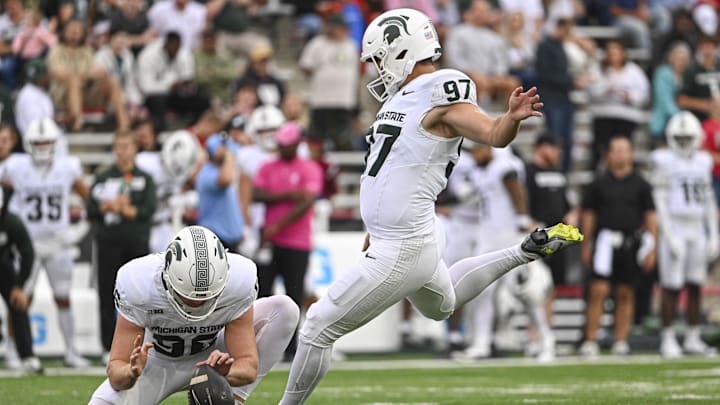 Sep 7, 2024; College Park, Maryland, USA; Michigan State Spartans place kicker Jonathan Kim (97) kicks a extra point during the first half against the Maryland Terrapins at SECU Stadium. Mandatory Credit: Tommy Gilligan-Imagn Images Sep 7, 2024; College Park, Maryland, USA; Michigan State Spartans place kicker Jonathan Kim (97) kicks a extra point during the first half against the Maryland Terrapins at SECU Stadium. Mandatory Credit: Tommy Gilligan-Imagn Images
