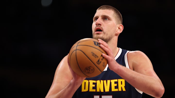 Los Angeles, California, USA;  Denver Nuggets center Nikola Jokic (15) shoots a free throw during the first quarter against the Los Angeles Lakers at Crypto.com Arena. Mandatory Credit: Kiyoshi Mio-Imagn Images