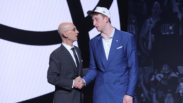 Jun 25, 2025; Brooklyn, NY, USA; Danny Wolf stands with NBA commissioner Adam Silver after being selected as the 27th pick by the Brooklyn Nets in the first round of the 2025 NBA Draft at Barclays Center. Mandatory Credit: Brad Penner-Imagn Images Jun 25, 2025; Brooklyn, NY, USA; Danny Wolf stands with NBA commissioner Adam Silver after being selected as the 27th pick by the Brooklyn Nets in the first round of the 2025 NBA Draft at Barclays Center. Mandatory Credit: Brad Penner-Imagn Images