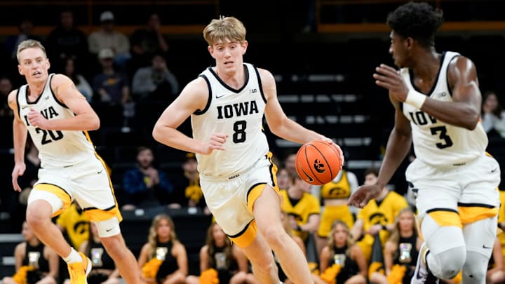 Iowa Hawkeyes forward Cooper Koch (8) dribbles down court against Rider Tuesday, Nov. 19, 2024 at Carver-Hawkeye Arena in Iowa City, Iowa.