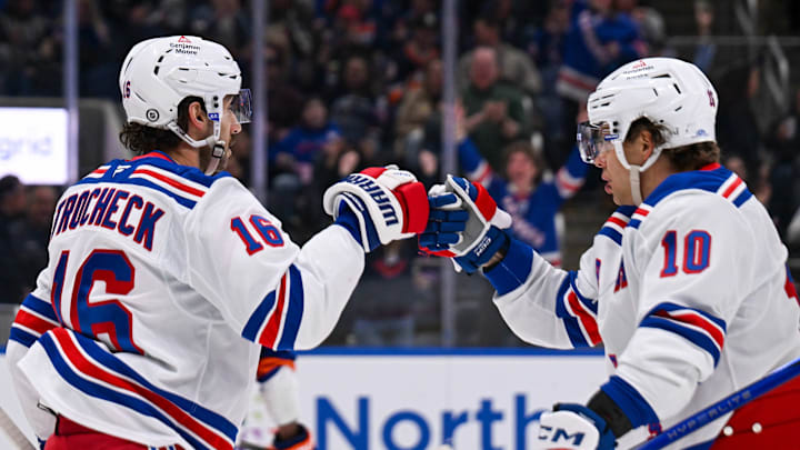 Apr 10, 2025; Elmont, New York, USA;  New York Rangers center Vincent Trocheck (16) celebrate his goal with New York Rangers left wing Artemi Panarin (10) against the New York Islanders during the first period at UBS Arena. Mandatory Credit: Dennis Schneidler-Imagn Images