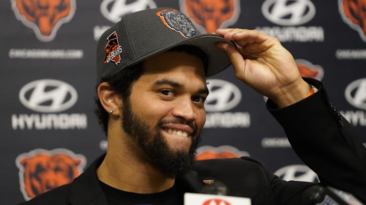 Caleb Williams rocks a Bears hat at his introductory press conference in Chicago last year.