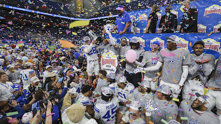 Dec 28, 2024; San Antonio, TX, USA; Brigham Young Cougars players celebrate after winning the Alamo Bowl against the Colorado Buffaloes at Alamodome. Mandatory Credit: Troy Taormina-Imagn Images Dec 28, 2024; San Antonio, TX, USA; Brigham Young Cougars players celebrate after winning the Alamo Bowl against the Colorado Buffaloes at Alamodome. Mandatory Credit: Troy Taormina-Imagn Images