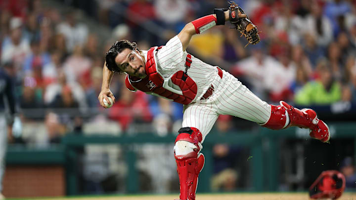 Sep 9, 2024; Philadelphia, Pennsylvania, USA; Philadelphia Phillies catcher Garrett Stubbs (21) fields a ball Tampa Bay Rays at Citizens Bank Park.