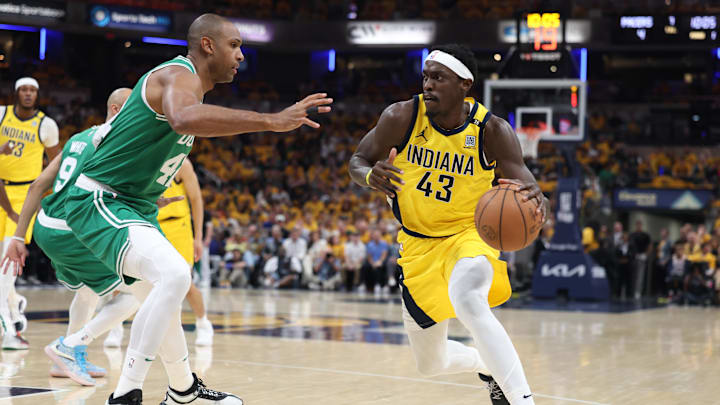 May 25, 2024; Indianapolis, Indiana, USA; Indiana Pacers forward Pascal Siakam (43) controls the ball against Boston Celtics center Al Horford (42) during the first quarter of game three of the eastern conference finals in the 2024 NBA playoffs at Gainbridge Fieldhouse. Mandatory Credit: Trevor Ruszkowski-Imagn Images