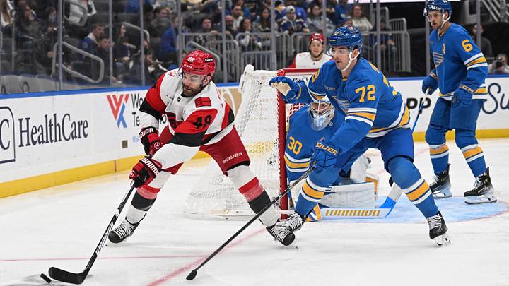 Oct 24, 2026; St. Louis, Missouri, USA; Carolina Hurricanes left wing Jordan Martinook (48) and St. Louis Blues defenseman Justin Barron (72) battle for the puck in the third period at Enterprise Center. Mandatory Credit: Joe Puetz-Imagn Images Oct 24, 2026; St. Louis, Missouri, USA; Carolina Hurricanes left wing Jordan Martinook (48) and St. Louis Blues defenseman Justin Barron (72) battle for the puck in the third period at Enterprise Center. Mandatory Credit: Joe Puetz-Imagn Images