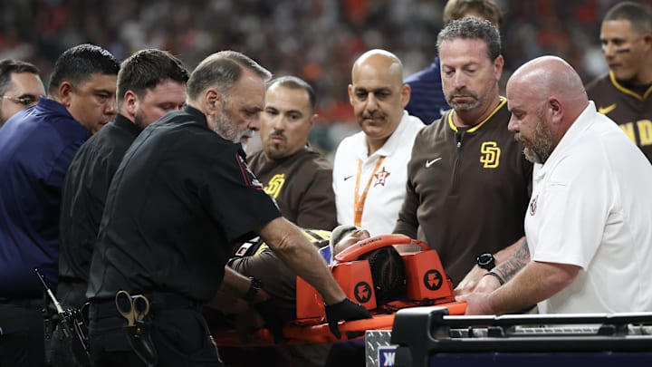 Apr 20, 2025; Houston, Texas, USA;San Diego Padres designated hitter Luis Arraez (4) is carted off the field after he colliding with Houston Astros first baseman Christian Walker (8) (not pictured )on the first base line  in the first inning  at Daikin Park. Mandatory Credit: Thomas Shea-Imagn Images