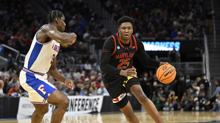 Mar 27, 2025; San Francisco, CA, USA; Maryland Terrapins center Derik Queen (25) dribbles down court past Florida Gators center Rueben Chinyelu (9) during the second half during a West Regional semifinal of the 2025 NCAA tournament at Chase Center. Mandatory Credit: Eakin Howard-Imagn Images