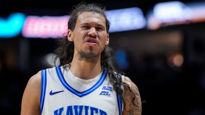 Jan 24, 2026; Cincinnati, Ohio, USA;  Xavier Musketeers forward Tre Carroll (12) reacts during a stop in play against the St. John's Red Storm in the second half at the Cintas Center. Mandatory Credit: Aaron Doster-Imagn Images