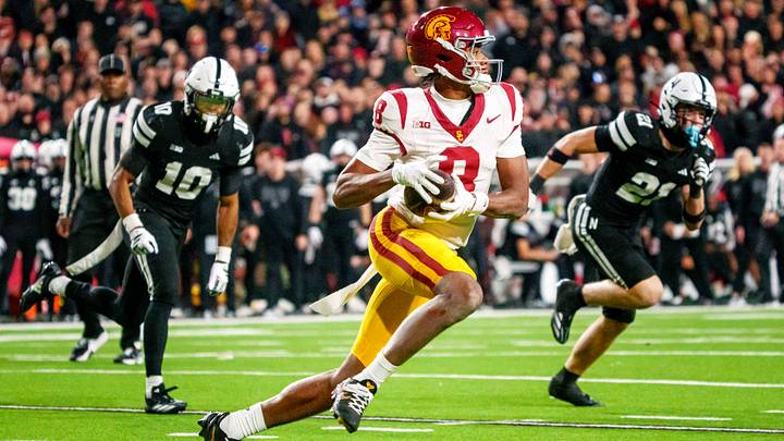 Nov 1, 2025; Lincoln, Nebraska, USA; Southern California Trojans wide receiver Ja'Kobi Lane (8) runs against Nebraska Cornhuskers defensive back Andrew Marshall (10) and defensive back Rex Guthrie (21) during the second quarter at Memorial Stadium. Mandatory Credit: Dylan Widger-Imagn Images Nov 1, 2025; Lincoln, Nebraska, USA; Southern California Trojans wide receiver Ja'Kobi Lane (8) runs against Nebraska Cornhuskers defensive back Andrew Marshall (10) and defensive back Rex Guthrie (21) during the second quarter at Memorial Stadium. Mandatory Credit: Dylan Widger-Imagn Images