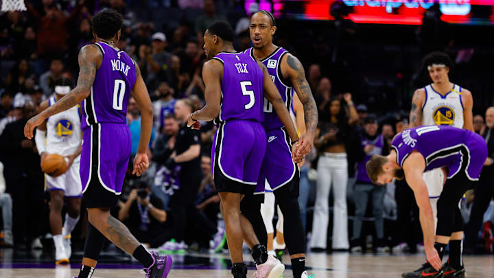 Jan 22, 2025; Sacramento, California, USA; Sacramento Kings forward DeMar DeRozan (10) celebrates with guard De'Aaron Fox (5) after a play during the fourth quarter against the Golden State Warriors at Golden 1 Center. Mandatory Credit: Sergio Estrada-Imagn Images
