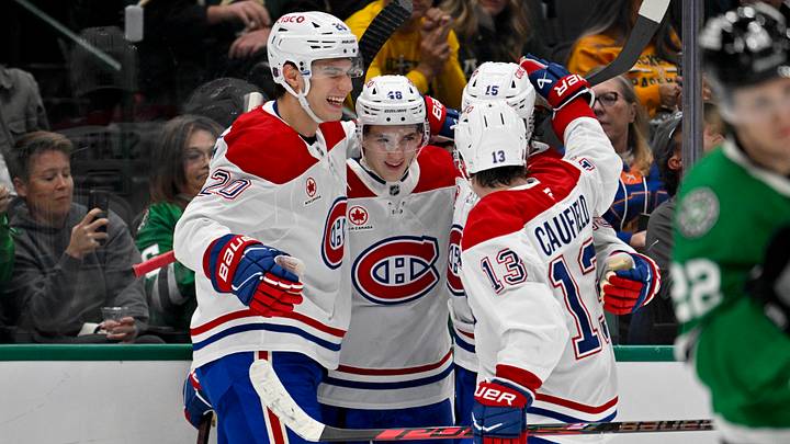 Oct 29, 2026; Dallas, Texas, USA; Montreal Canadiens center Alex Newhook (15) and defenseman Lane Hutson (48) and left wing Juraj Slafkovsky (20) and right wing Cole Caufield (13) celebrates a goal scored by center Alex Newhook (15) against the Dallas Stars during first period at American Airlines Center. Mandatory Credit: Jerome Miron-Imagn Images