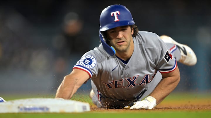 Apr 10, 2026; Los Angeles, California, USA;  Texas Rangers shortstop Josh Smith (8) dives back to first base on a pick off attempt by the Los Angeles Dodgers during the third inning at Dodger Stadium. Mandatory Credit: Jayne Kamin-Oncea-Imagn Images