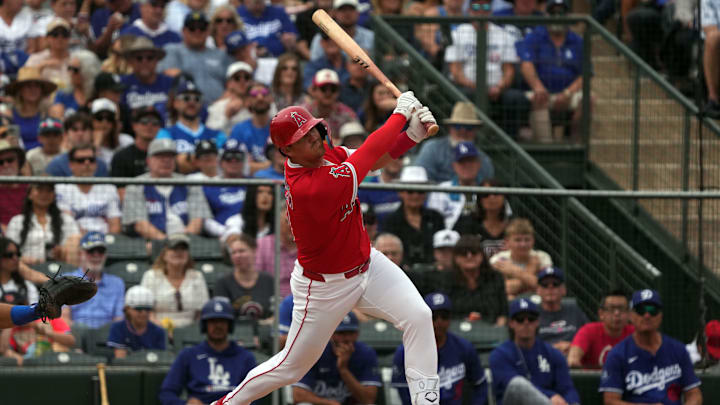 Mar 5, 2025; Tempe, Arizona, USA; Los Angeles Angels shortstop Kevin Newman (10) hits against the Los Angeles Dodgers in the third inning at Tempe Diablo Stadium. Mandatory Credit: Rick Scuteri-Imagn Images