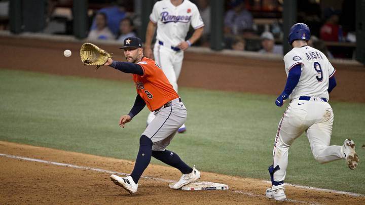 May 25, 2026; Arlington, Texas, USA; Houston Astros first baseman Christian Walker (8) puts out Texas Rangers catcher Danny Jansen (9) during the eighth inning at Globe Life Field. Mandatory Credit: Jerome Miron-Imagn Images May 25, 2026; Arlington, Texas, USA; Houston Astros first baseman Christian Walker (8) puts out Texas Rangers catcher Danny Jansen (9) during the eighth inning at Globe Life Field. Mandatory Credit: Jerome Miron-Imagn Images