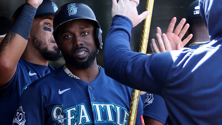 Sep 13, 2026; West Sacramento, California, USA; Seattle Mariners left fielder Randy Arozarena (56) holds the trident while celebrating with teammates in the dugout after hitting a two-run home run against Athletics starting pitcher Jacob Lopez (not pictured) during the third inning at Sutter Health Park. Mandatory Credit: Dennis Lee-Imagn Images Sep 13, 2026; West Sacramento, California, USA; Seattle Mariners left fielder Randy Arozarena (56) holds the trident while celebrating with teammates in the dugout after hitting a two-run home run against Athletics starting pitcher Jacob Lopez (not pictured) during the third inning at Sutter Health Park. Mandatory Credit: Dennis Lee-Imagn Images