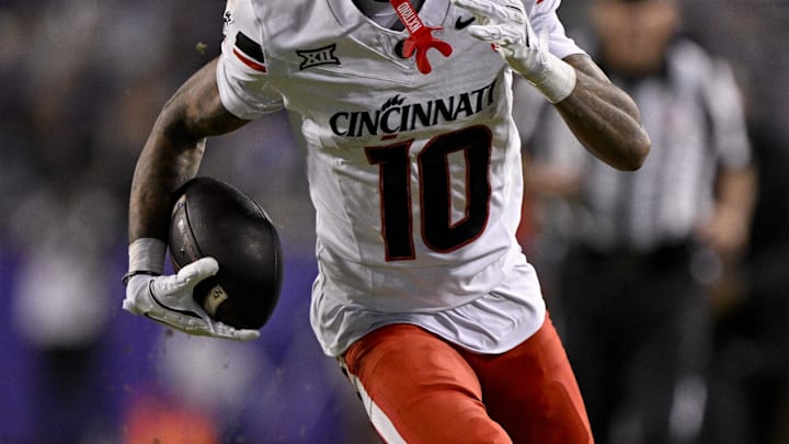 Nov 29, 2025; Fort Worth, Texas, USA; Cincinnati Bearcats wide receiver Caleb Goodie (10) runs with the ball during the game between the Horned Frogs and the Bearcats at Amon G. Carter Stadium. Mandatory Credit: Jerome Miron-Imagn Images