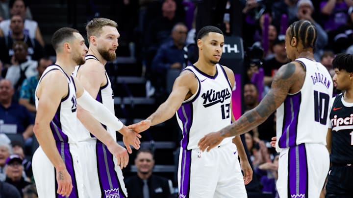 Mar 27, 2025; Sacramento, California, USA; Sacramento Kings forward Keegan Murray (13) is congratulated by teammates during the fourth quarter against the Portland Trail Blazers at Golden 1 Center. Mandatory Credit: Sergio Estrada-Imagn Images