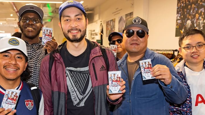 Collectors showing off packs of 2024-25 Topps Chrome UCC Collectors showing off packs of 2024-25 Topps Chrome UCC