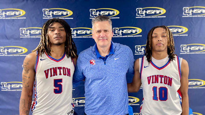 Vinton coach Keith Kelly with Jaheim Levias (left) and Keithan Rigmaiden 