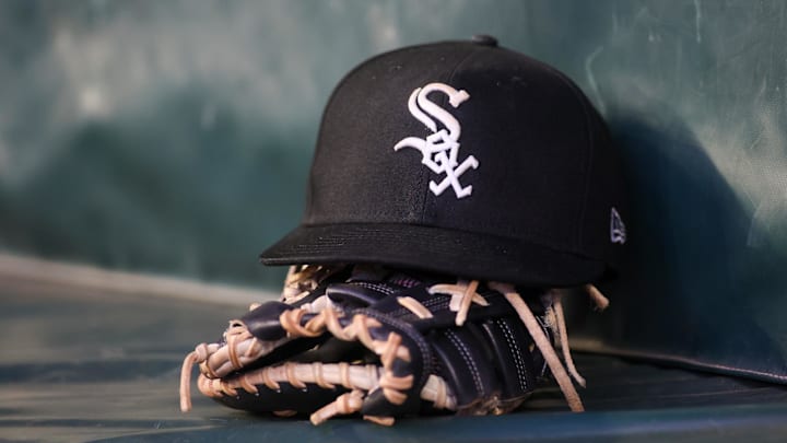 Jul 14, 2023; Atlanta, Georgia, USA; A detailed view of a Chicago White Sox hat and glove in the dugout against the Atlanta Braves in the fourth inning at Truist Park. Mandatory Credit: Brett Davis-Imagn Images