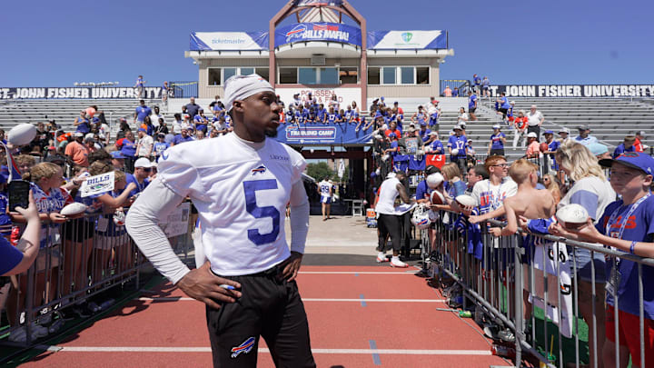 Buffalo Bills wide receiver Joshua Palmer, looks for his helmet after it disappeared while he was signing autographs.