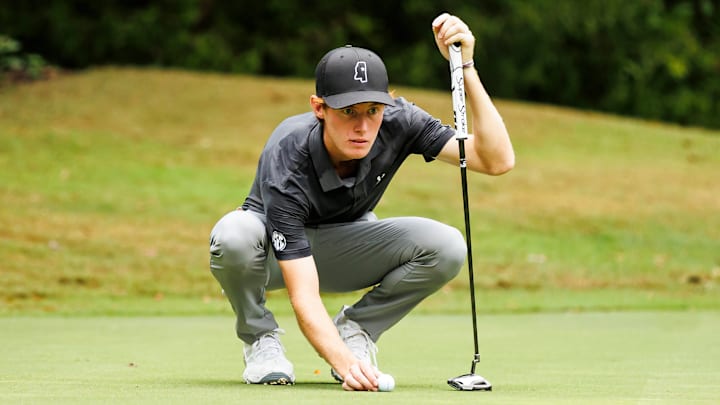 Mississippi State's Ugo Malcor lines up a putt.
