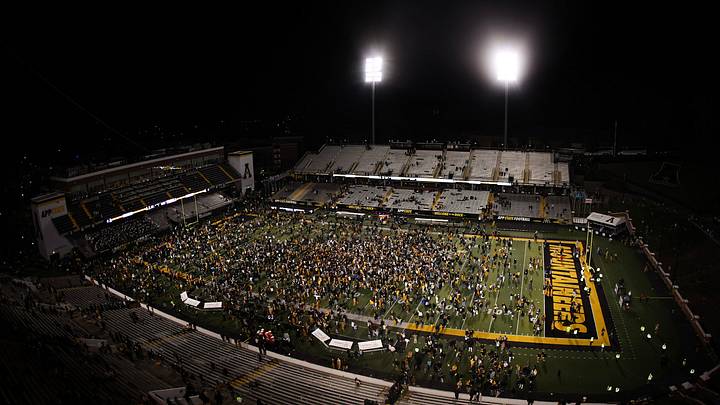 Appalachian State fans rushed the field after an upset victory over James Madison. Appalachian State fans rushed the field after an upset victory over James Madison.