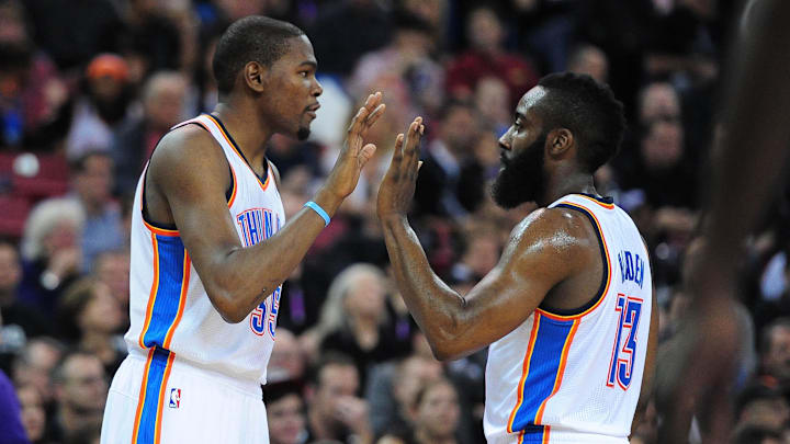 February 9, 2012; Sacramento, CA, USA; Oklahoma City Thunder small forward Kevin Durant (left) high-fives guard James Harden (right) during the second quarter against the Sacramento Kings at Power Balance Pavilion. Mandatory Credit: Kyle Terada-Imagn Images