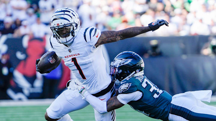 Cincinnati Bengals wide receiver Ja'Marr Chase (1) tries to break free from Philadelphia Eagles cornerback Isaiah Rodgers (34) at Paycor Stadium Sunday October 27, 2024. The Bengals lost 37-17 and remain winless at home.