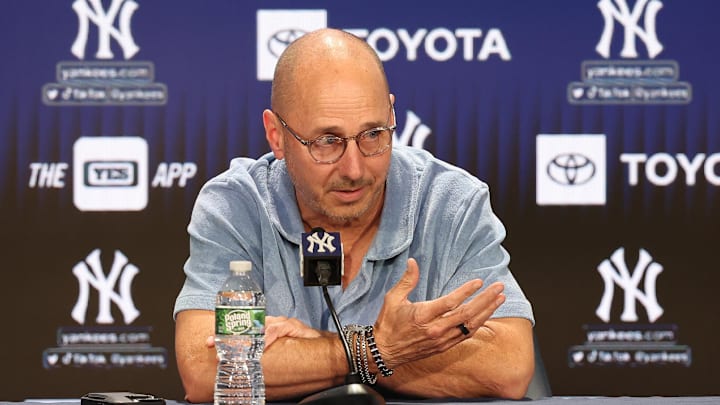 Aug 23, 2023; Bronx, New York, USA; New York Yankees general manager Brian Cashman talks with the media before the game between the Yankees and the Washington Nationals at Yankee Stadium. Mandatory Credit: Vincent Carchietta-Imagn Images