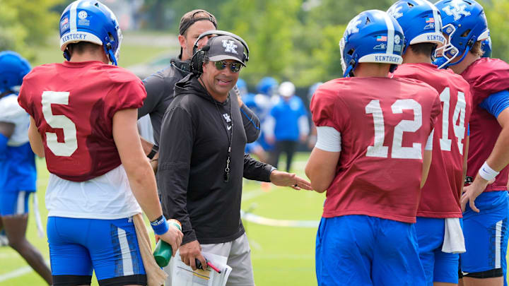 Kentucky Wildcats offensive coordinator and quarterback coach Bush Hamdan coaches the quarterbacks during practice on Friday, August 1, 2025
