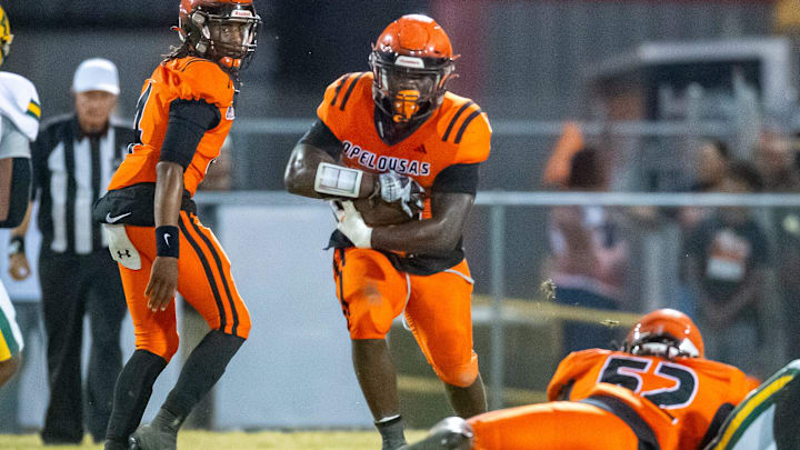 D'shaun Ford 22 runs the ball as the Opelousas High Tigers take on the Cecilia Bulldogs. Friday, Oct. 25, 2024.