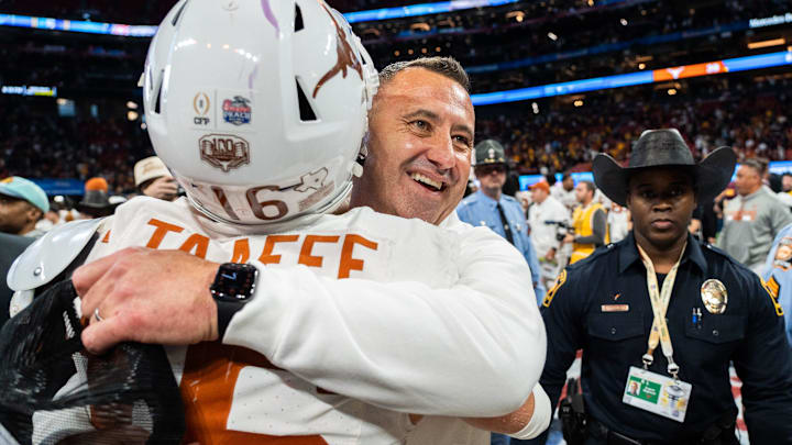 Texas Longhorns head coach Steve Sarkisian embraces Texas Longhorns defensive back Michael Taaffe (16) as they celebrate their win in the Peach Bowl College Football Playoff quarterfinal against Arizona State at Mercedes-Benz Stadium in Atlanta, Georgia, Jan. 1, 2025.