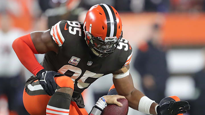 Cleveland Browns defensive end Myles Garrett (95) pats Cincinnati Bengals quarterback Joe Burrow (9) after sacking him during the second half of an NFL football game at FirstEnergy Stadium, Monday, Oct. 31, 2022, in Cleveland, Ohio. [Jeff Lange/Beacon Journal]