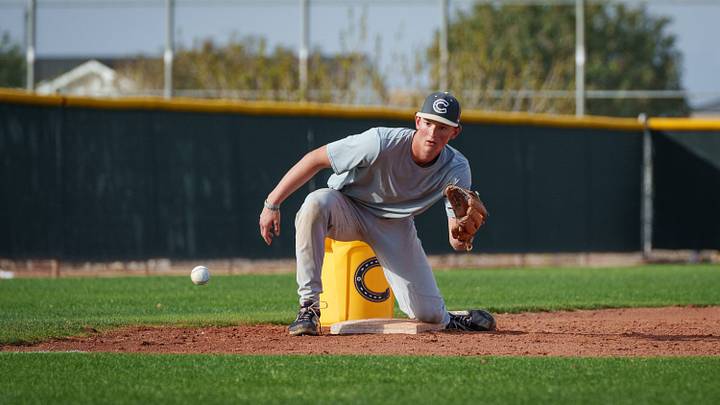 Senior third baseman Ryne Barker fields a ball during practice at the Casteel High School baseball field on Feb. 18, 2026, in Queen Creek. Senior third baseman Ryne Barker fields a ball during practice at the Casteel High School baseball field on Feb. 18, 2026, in Queen Creek.